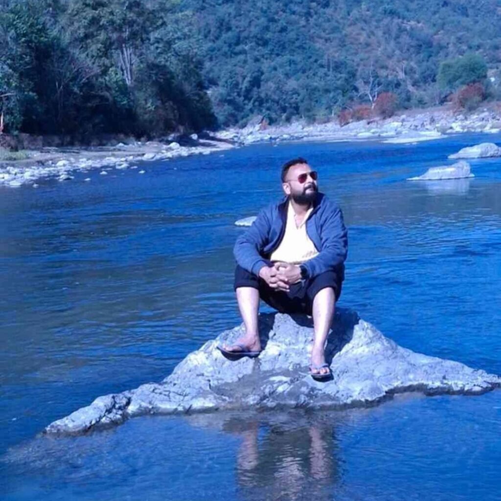 Jai Om Dave is enjoying the scenic beauty of mother nature in the middle of a river in himalayas